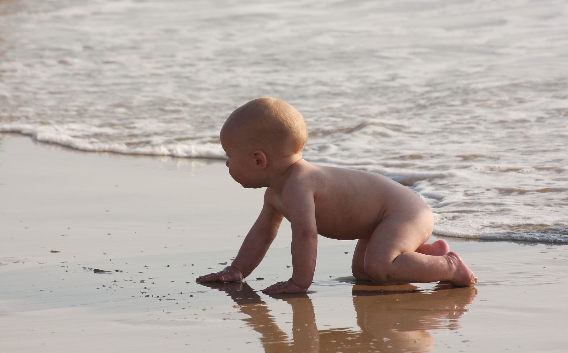baby_playing_on_beach_sand-other.jpg